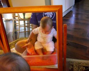 Rice play at 4.5 months. Feet don't have to be excluded from sensory play!